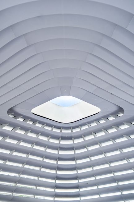 Futuristic interior architecture with a geometric skylight in Kuala Lumpur.