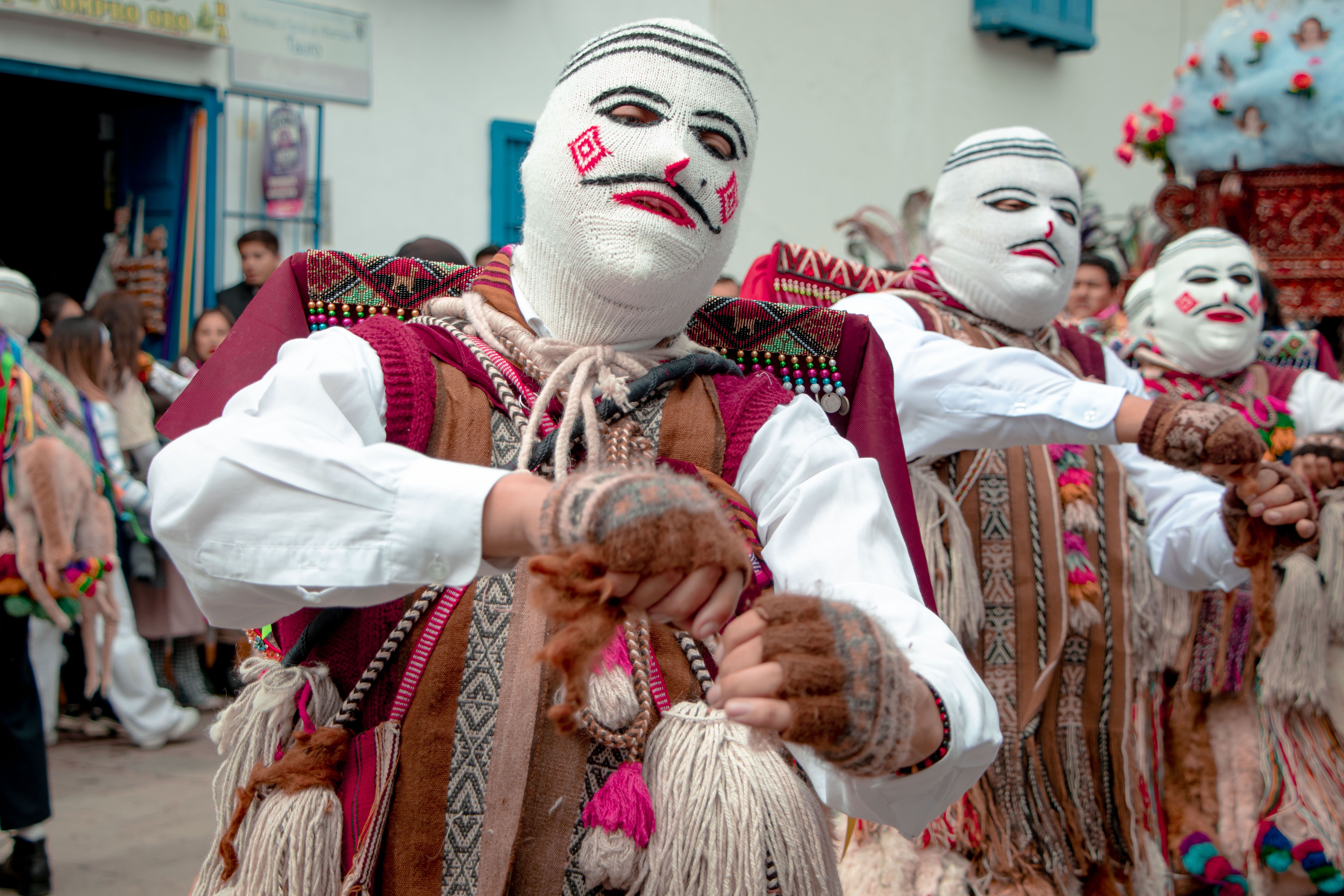 Masked dancers perform in the Virgen del Carmen festival in Paucartambo, Peru.