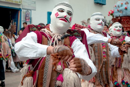 Masked dancers perform in the Virgen del Carmen festival in Paucartambo, Peru.
