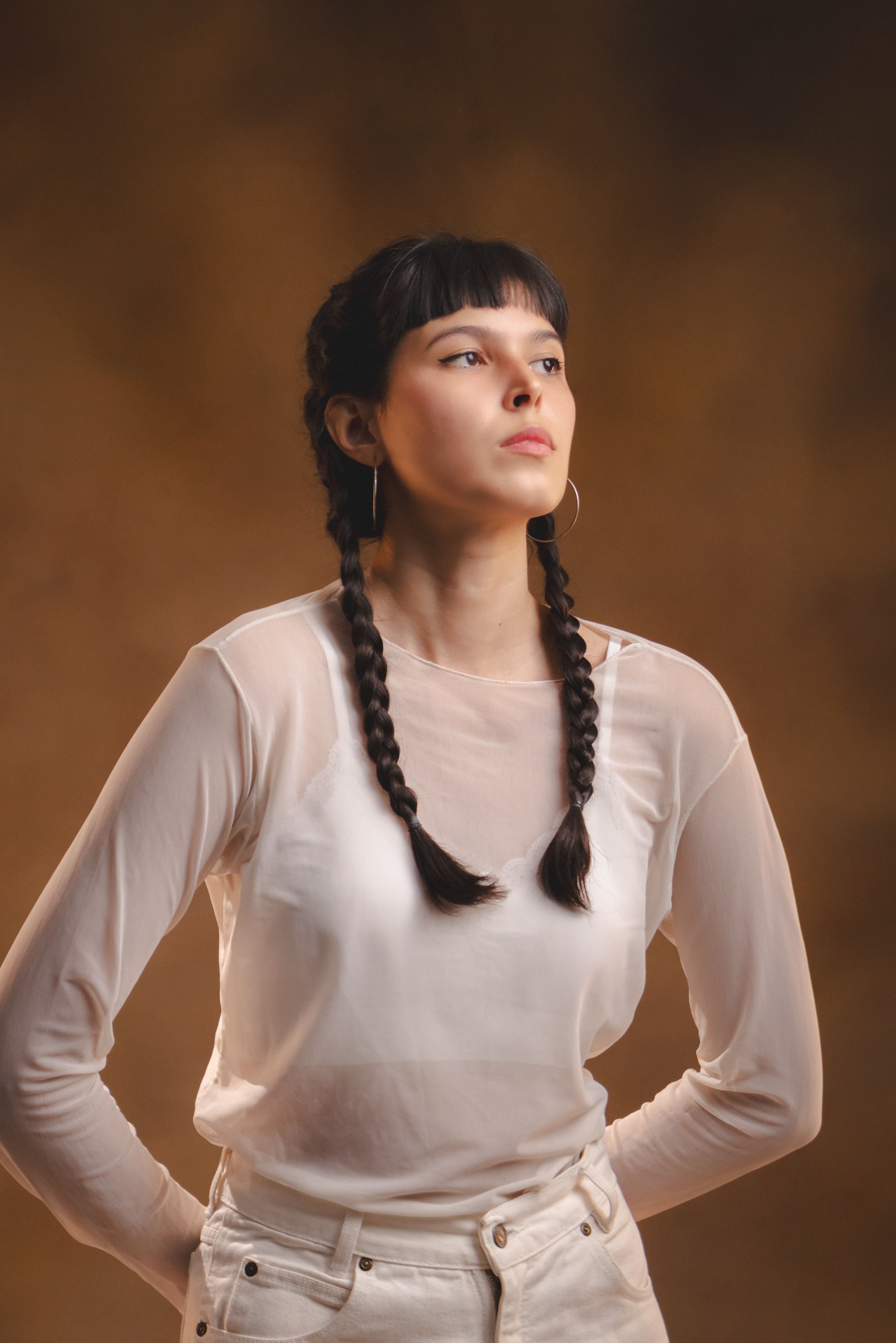 A woman with long hair posing for a portrait · Free Stock Photo