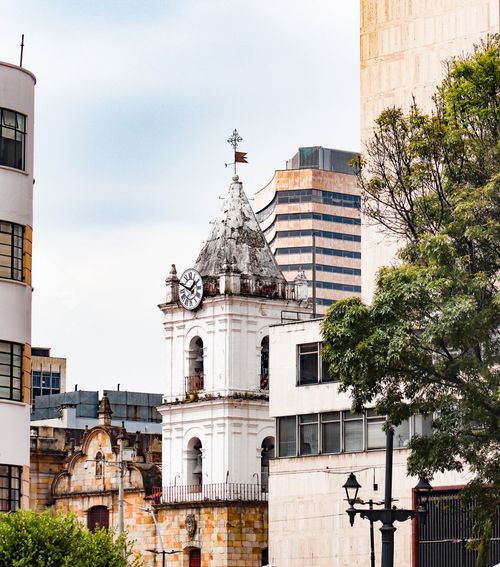 Free A scenic view of the historic clock tower and modern buildings in Bogotá, Colombia. Stock Photo