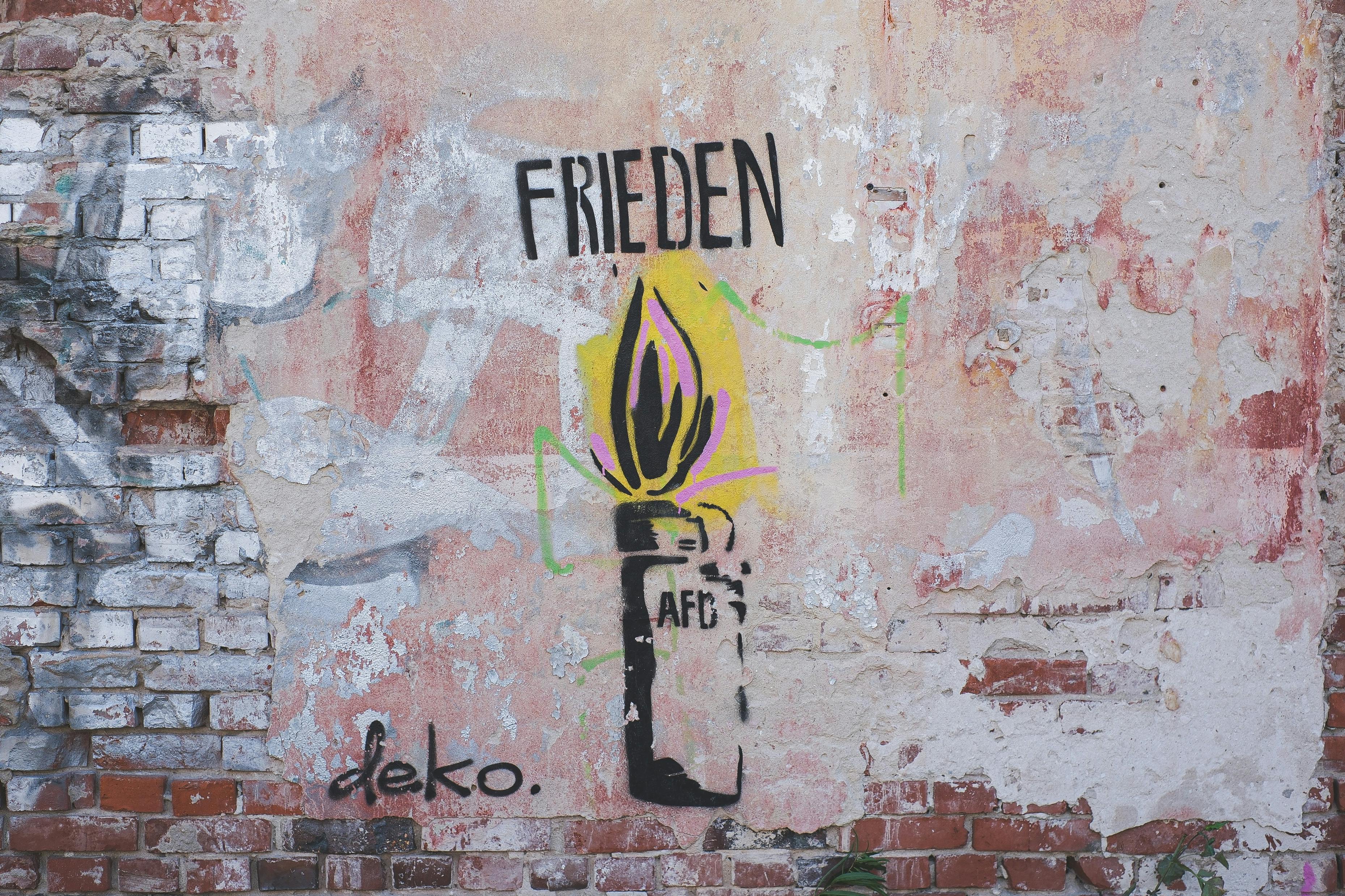 a graffiti on a wall with the word freund