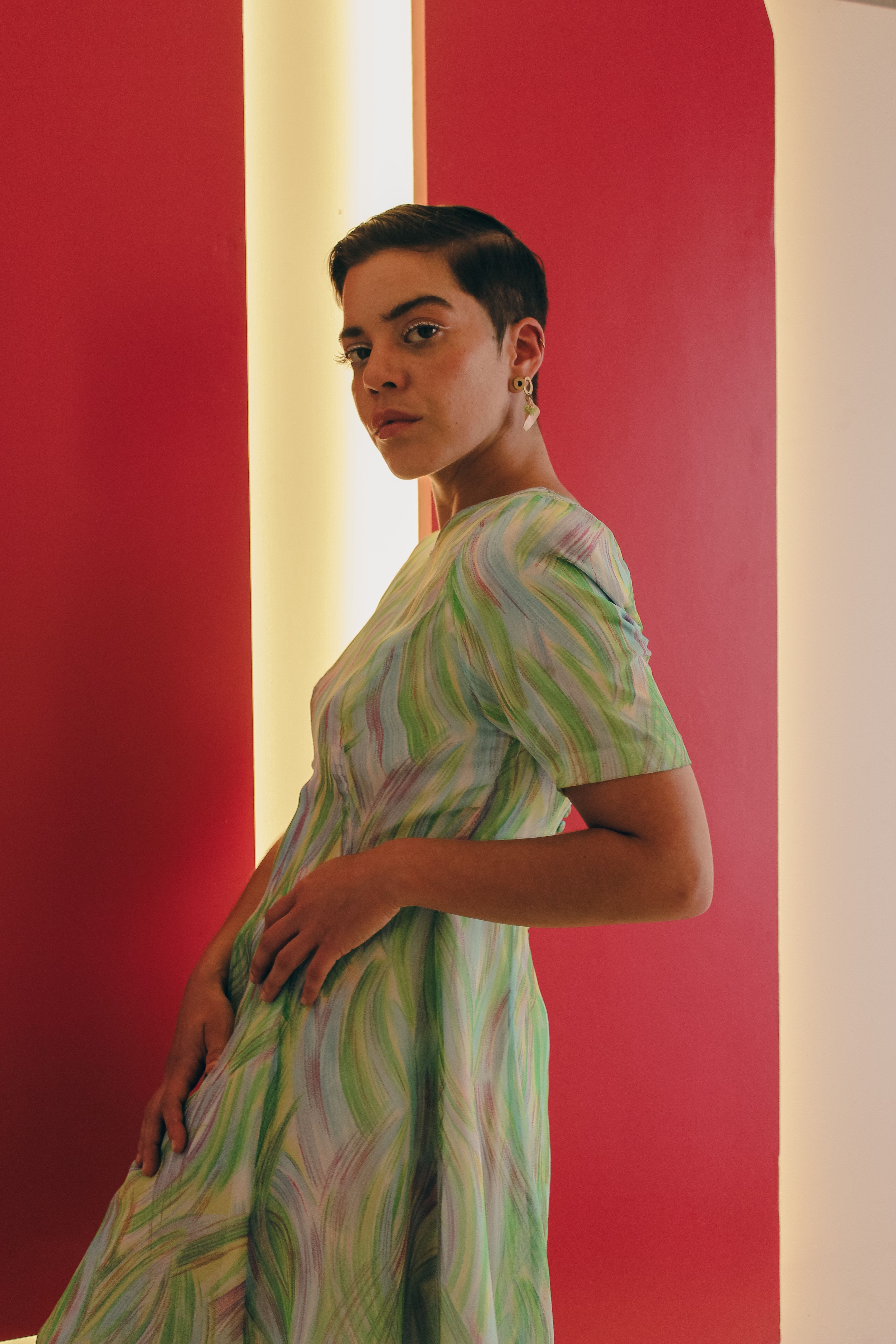 A woman in a green dress posing for a photo · Free Stock Photo