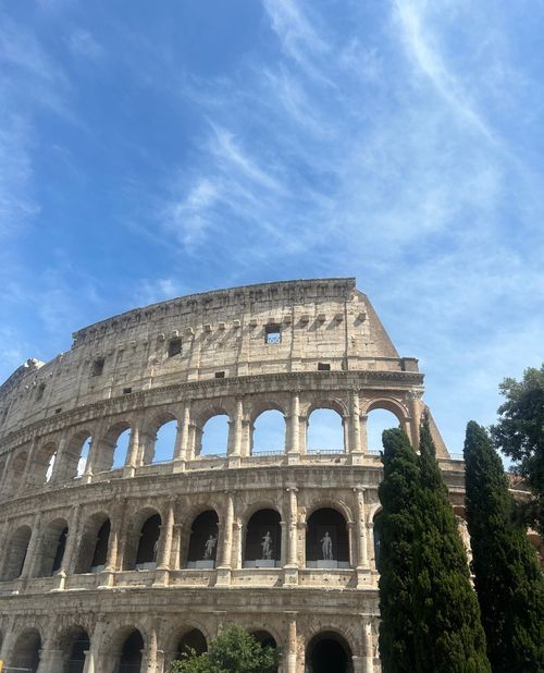 Free Explore the ancient beauty of the Colosseum in Rome with its stunning architecture and historical significance. Stock Photo