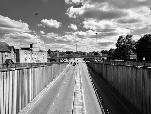 Free A black and white photograph of a motorway in Reading, England under a bright sky. Stock Photo