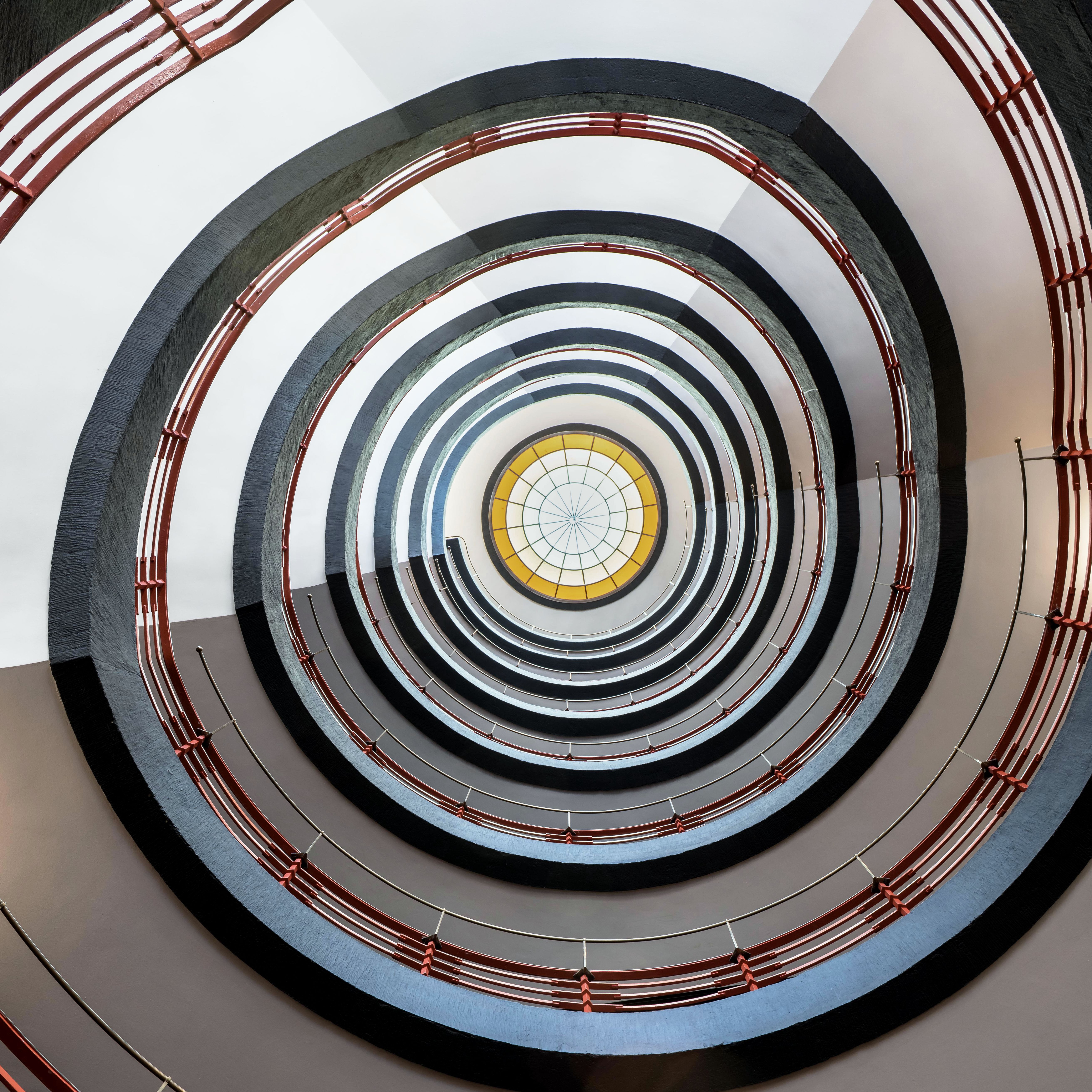 Captivating spiral staircase with geometric patterns in Hamburg, Germany.