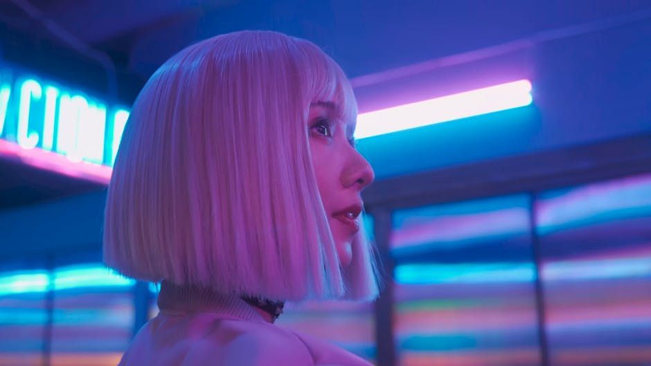 Side profile of a woman with neon lights, creating a futuristic look.