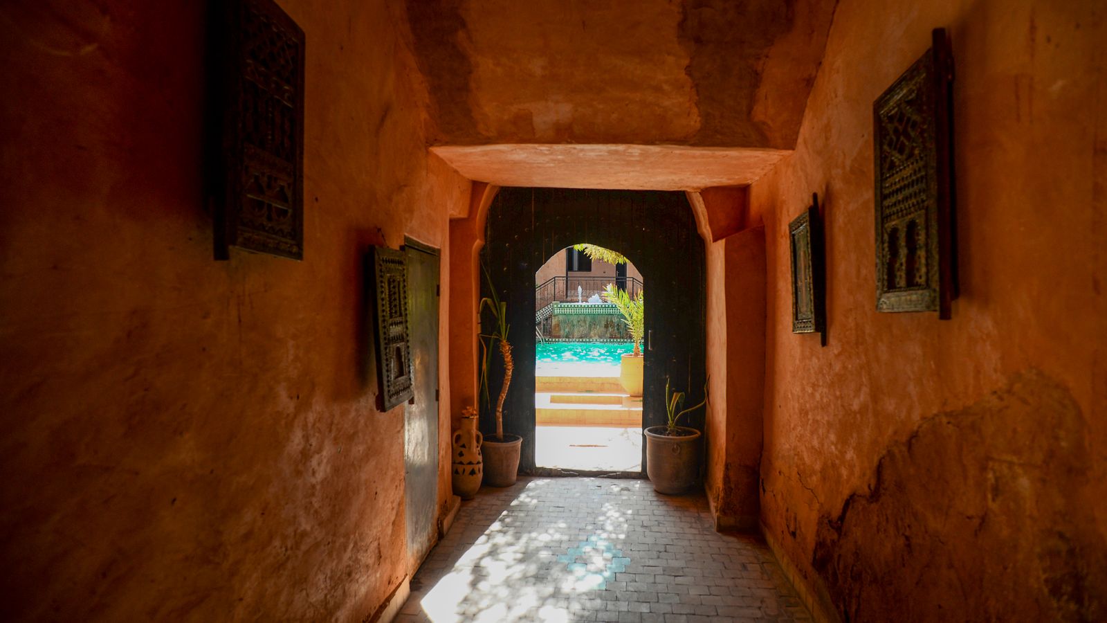 The entrance to an old building with a pool, Mauritania