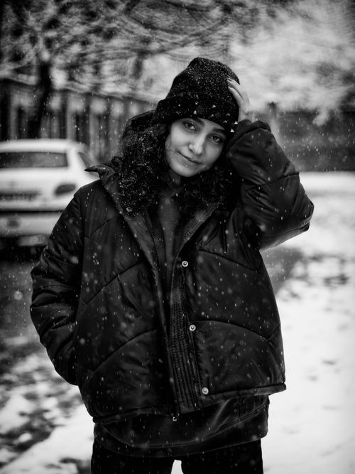 Free Black and white portrait of a woman in winter clothing in İstanbul snow. Stock Photo