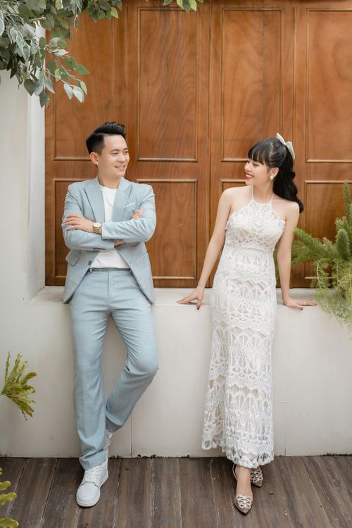 Free Charming couple in elegant attire posing during their wedding indoors. Stock Photo
