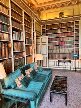 A room with a couch and bookshelves by Stephan Leuzinger