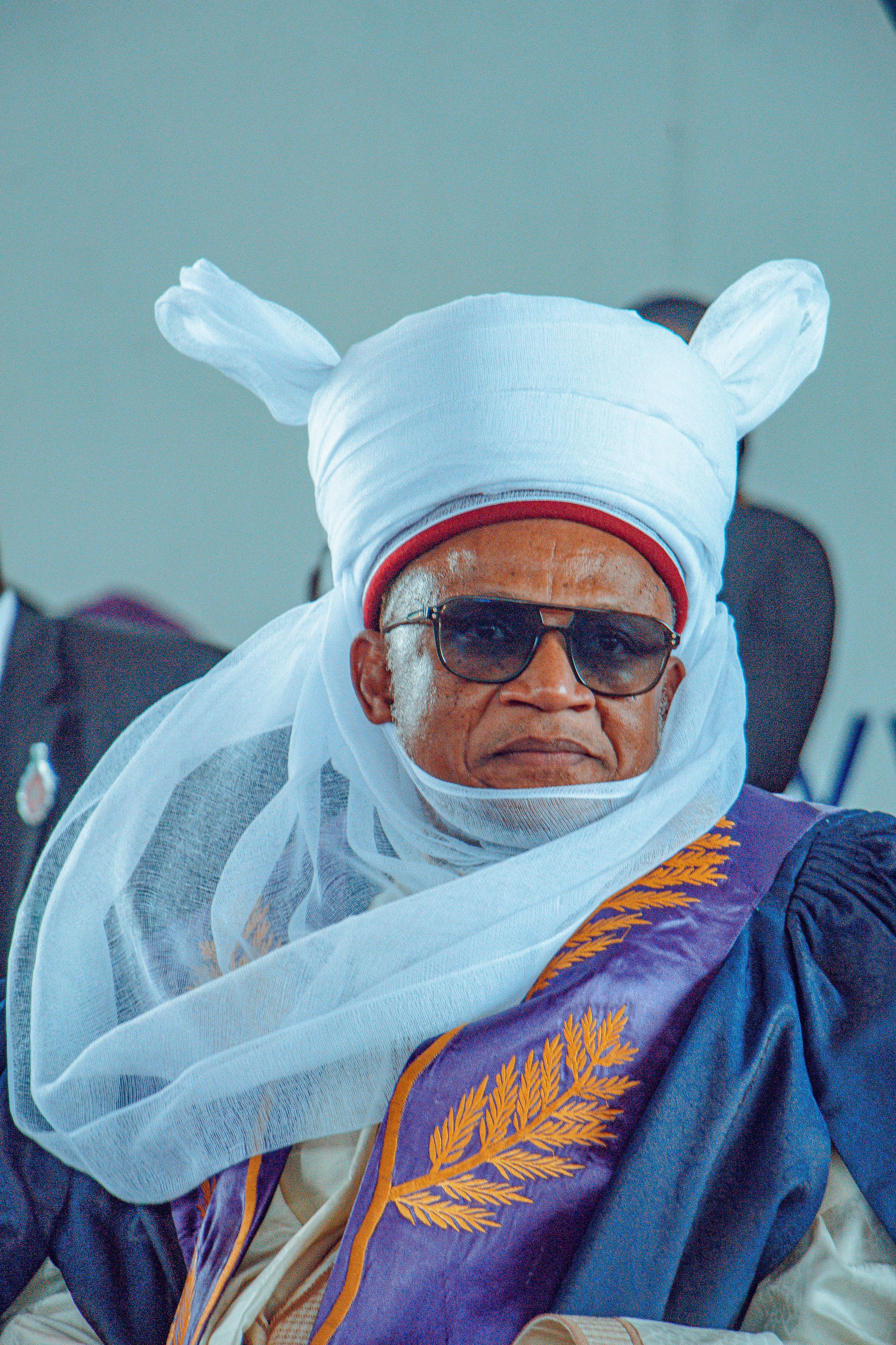 A man wearing traditional Yoruba attire during a cultural event in Ife, Nigeria.