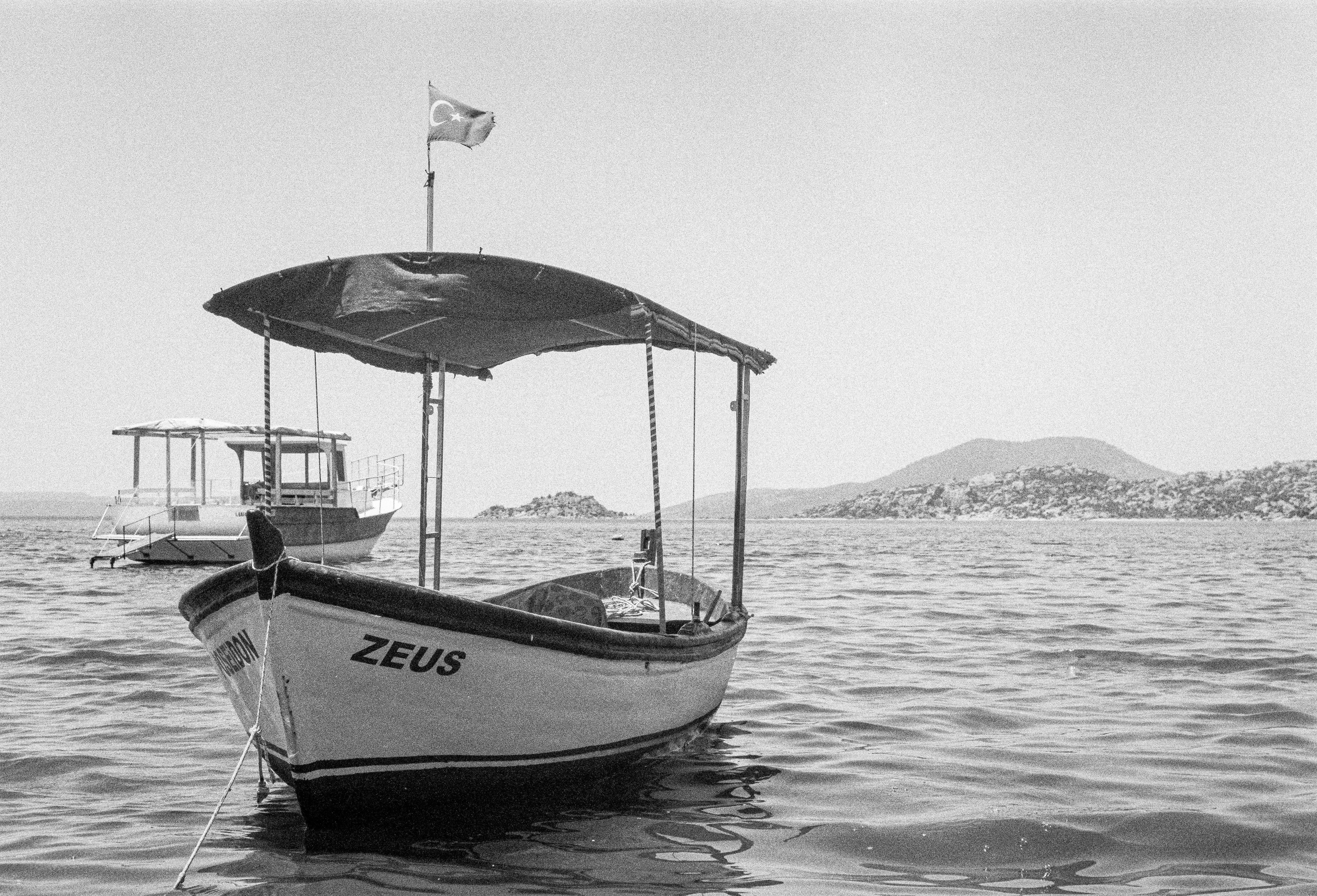 a small boat is docked in the water