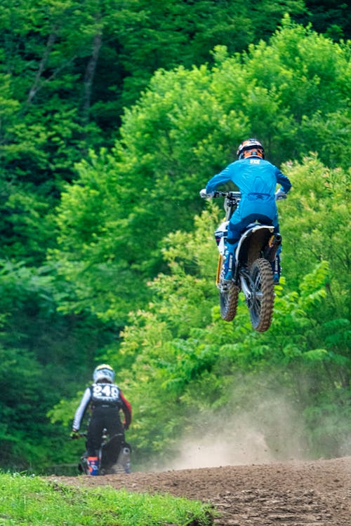 Two Men Riding Motocross Dirt Bikes