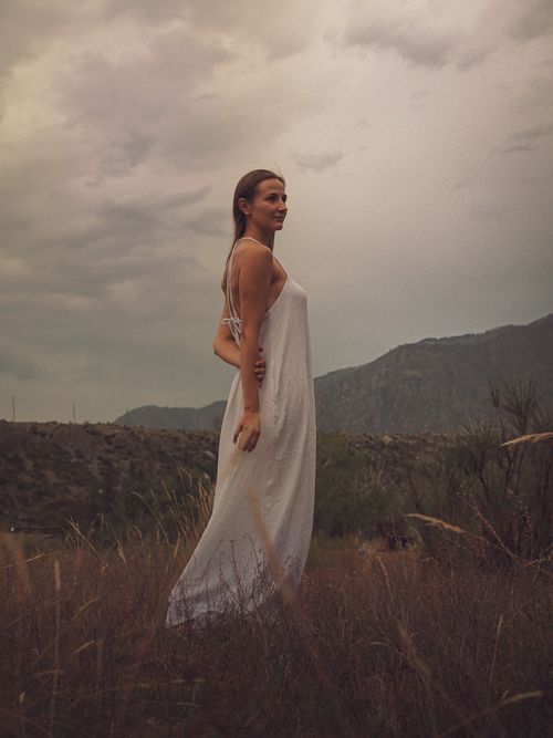 Woman in Backless Dress Standing Beside Rock Formation Free Stock Photo Woman in Backless Dress Standing Beside Rock Formation Free Stock Photo