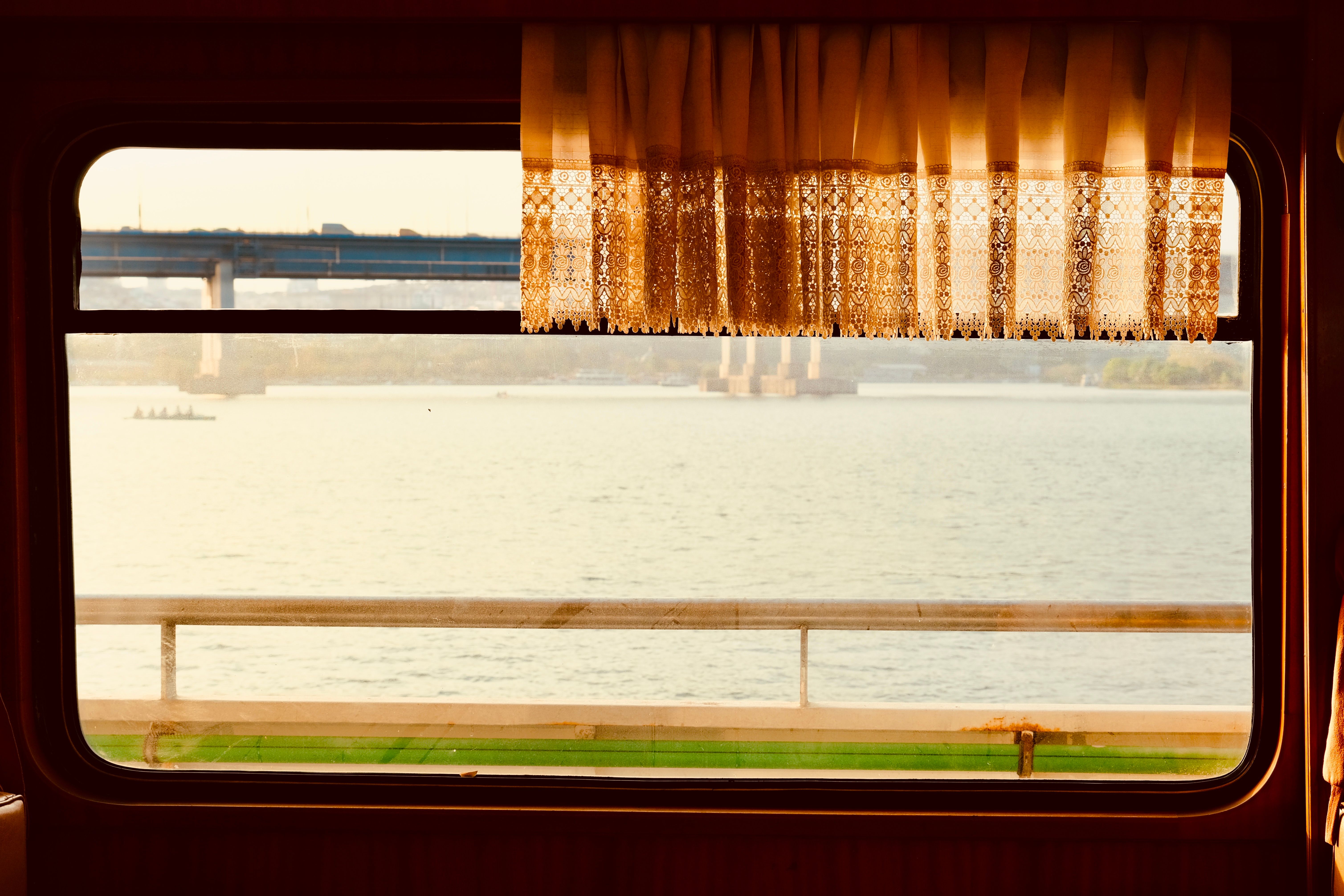 Travelers looking out a train window