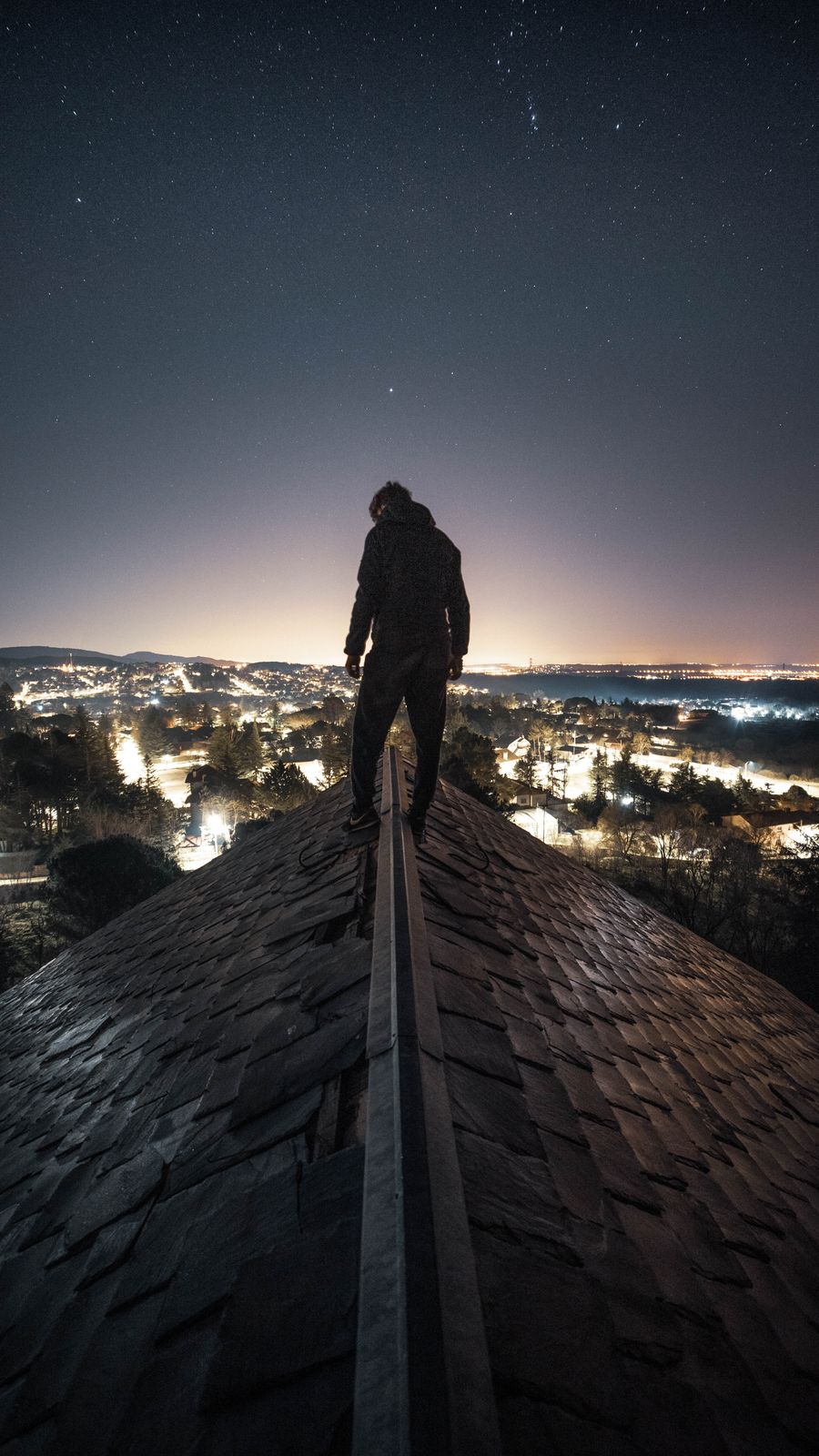 Silhouette on a rooftop under a starry night sky — photo by Alejandro De Roa on Pexels