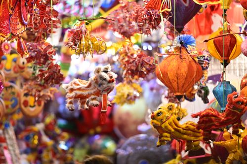 Free Colorful lanterns and decorations at a Hanoi market for the Mid-Autumn Festival. Stock Photo