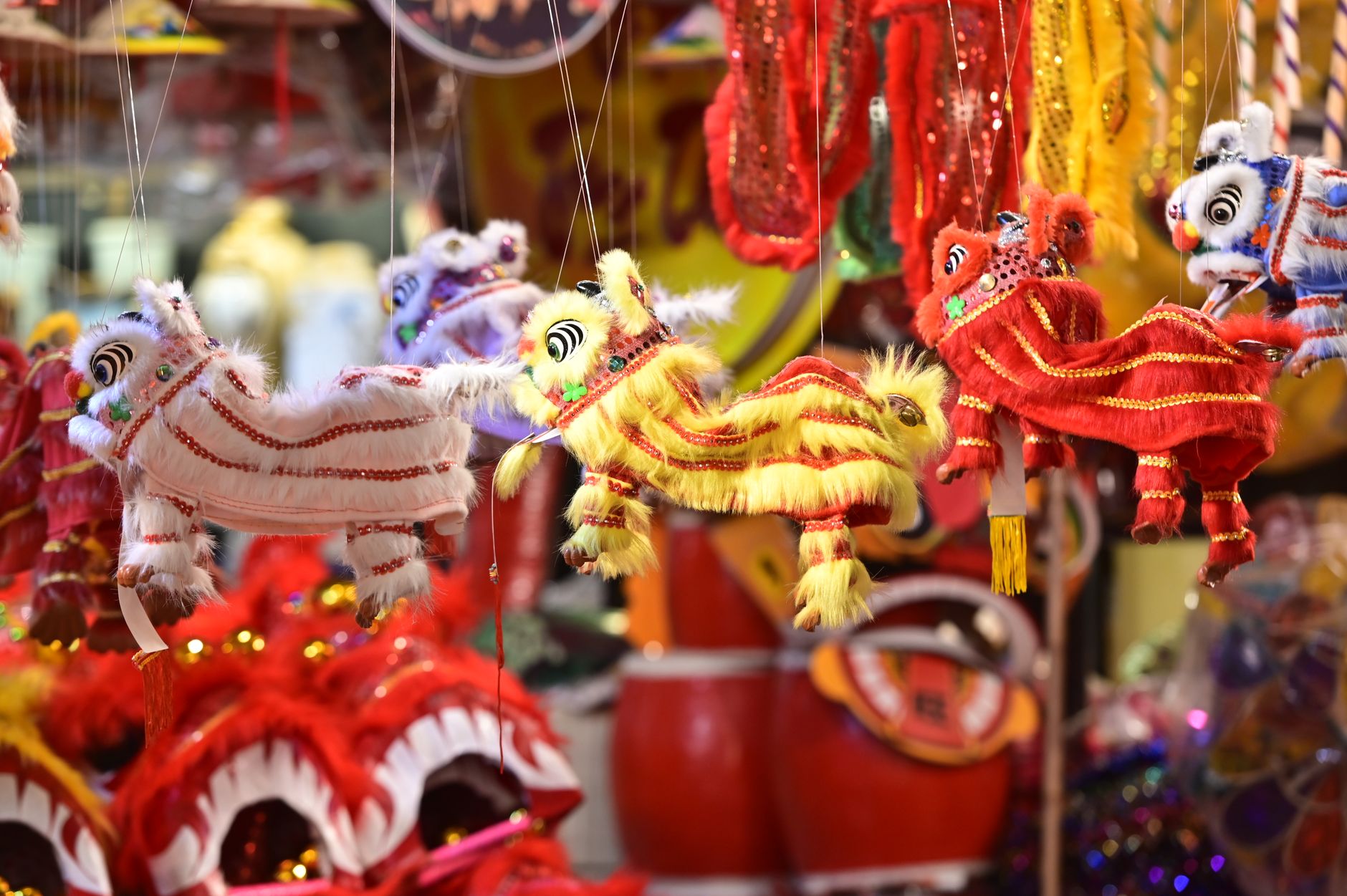 Colorful lion toys at a Hanoi festival, perfect for Mid-Autumn celebrations.