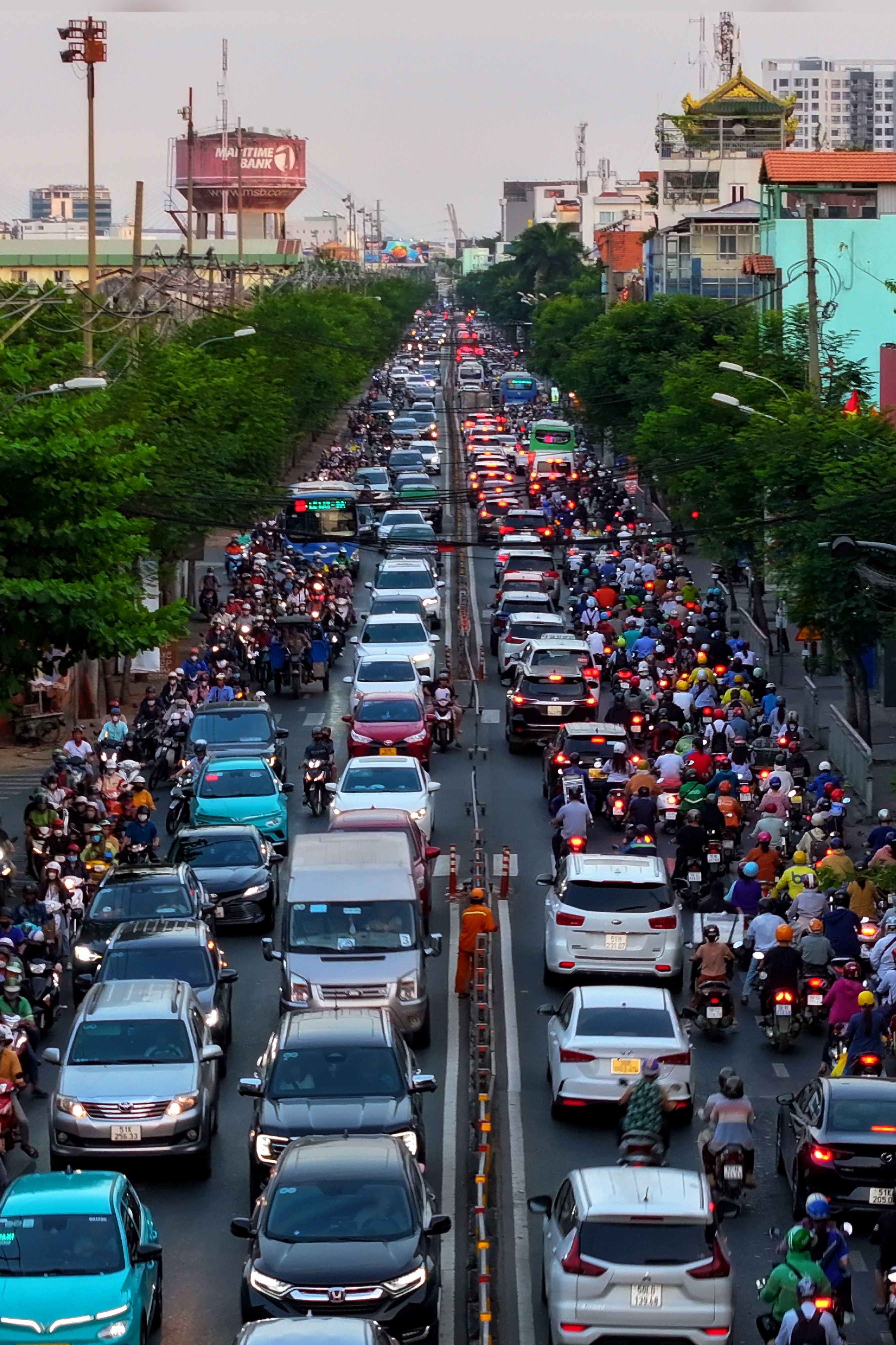 Aerial view of a crowded traffic jam with cars and motorcycles in Ho Chi Minh City, Vietnam.