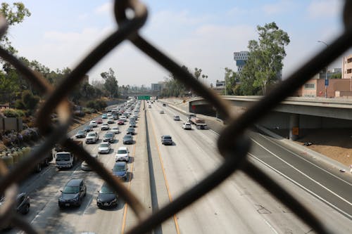 Free stock photo of chain link fence, highway, los angeles