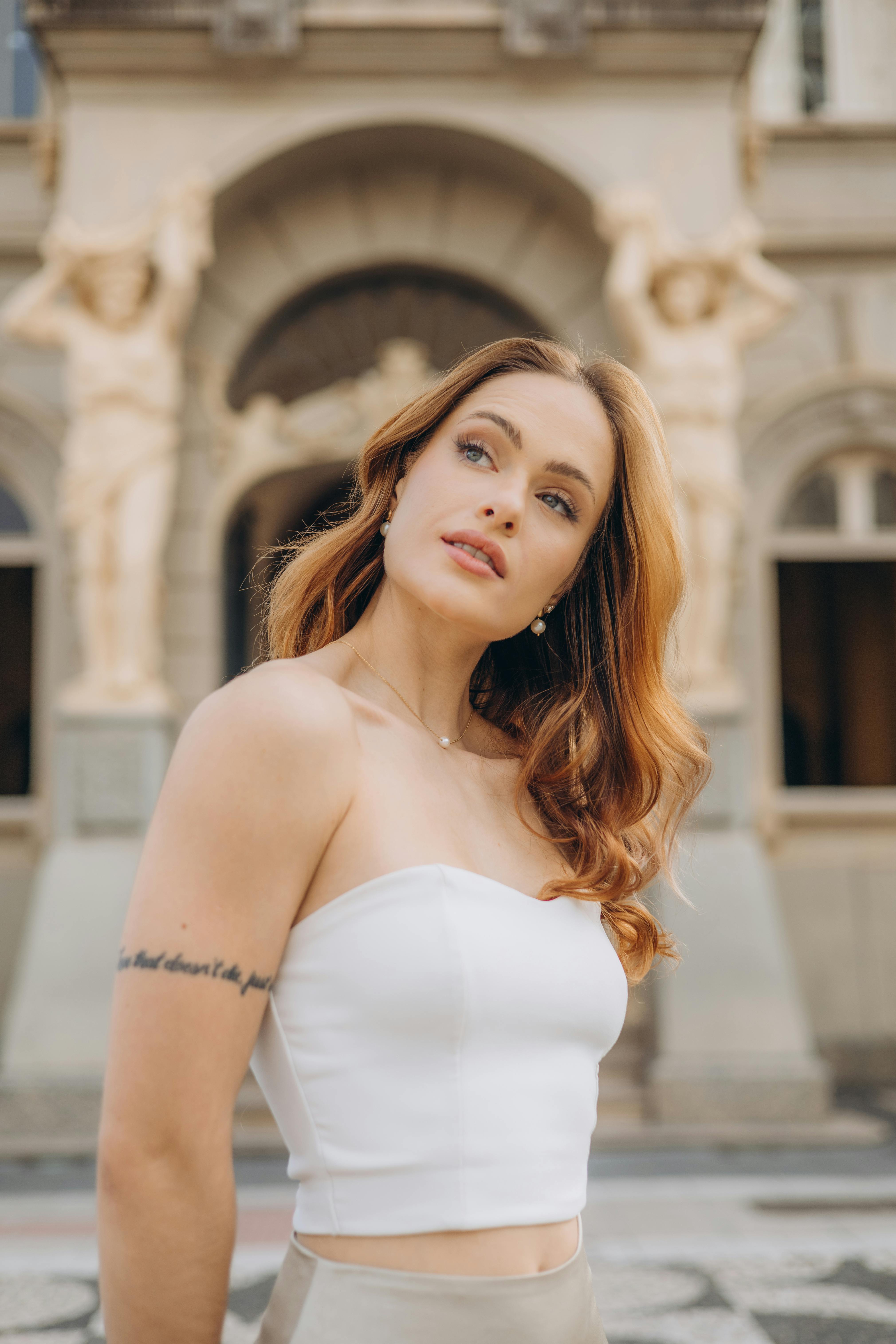 portrait of blonde woman in white dress