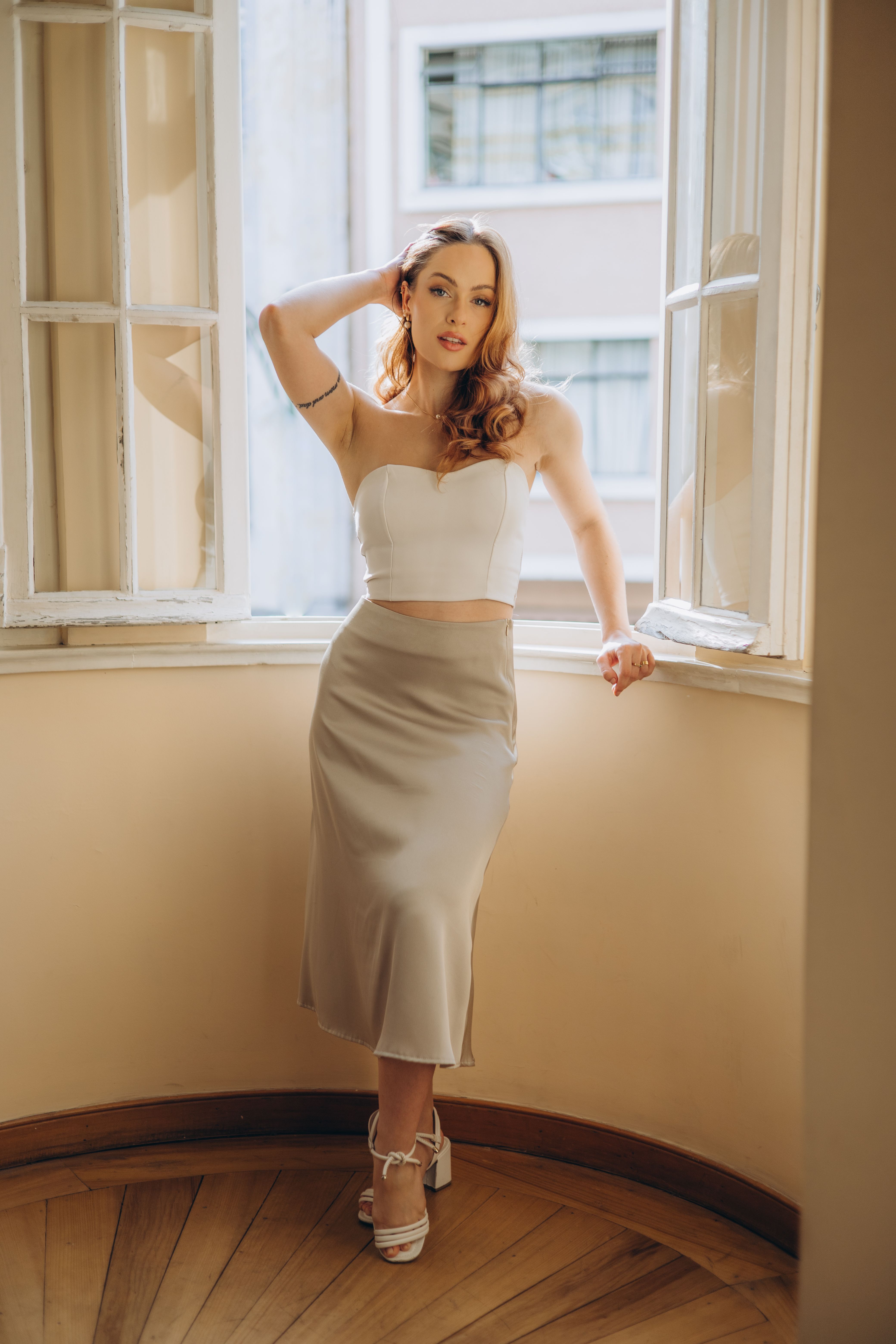 Woman in corset top with midi skirt