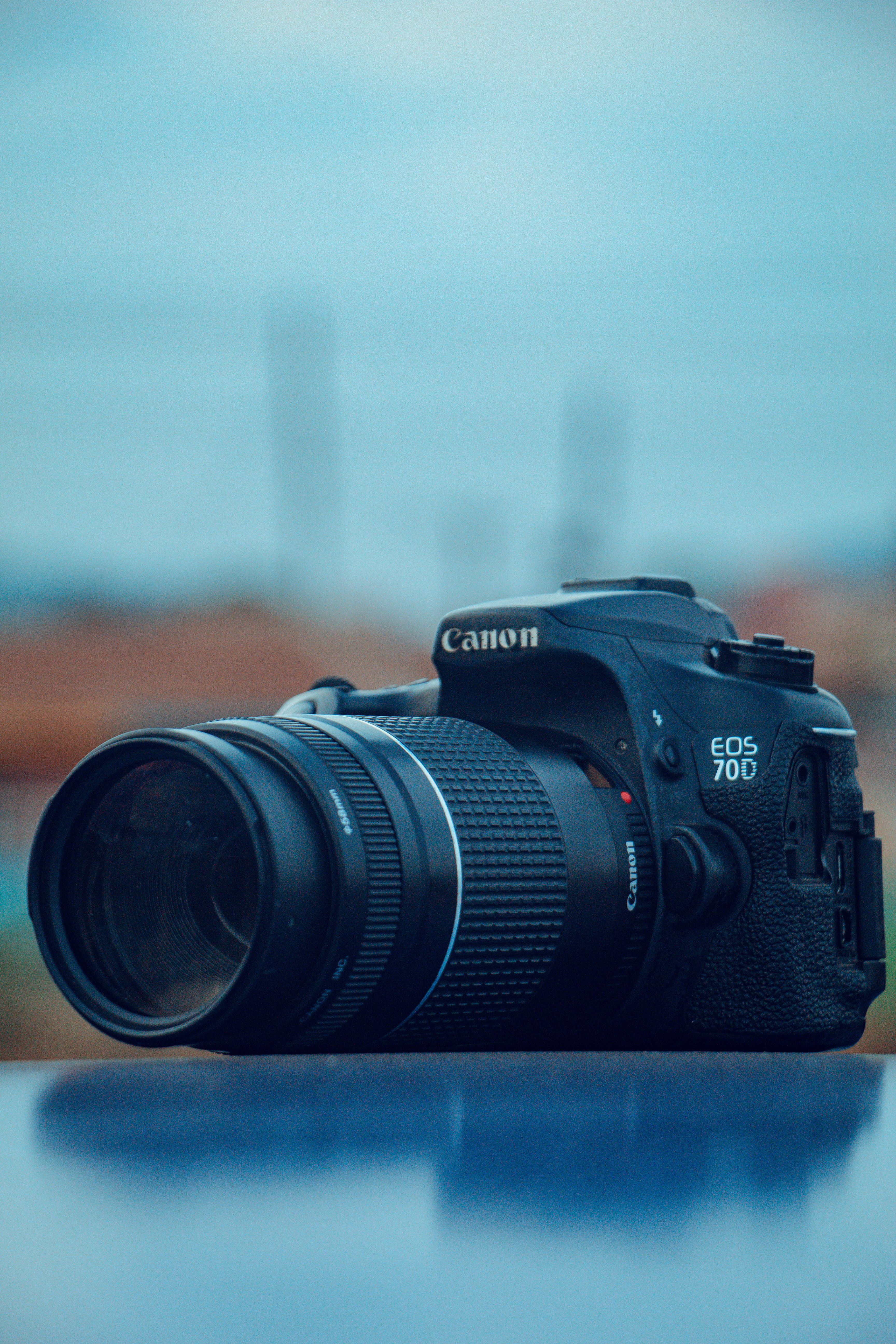 Canon DSLR camera with telephoto lens captured outdoors in Ife, Nigeria, showcasing photography equipment.