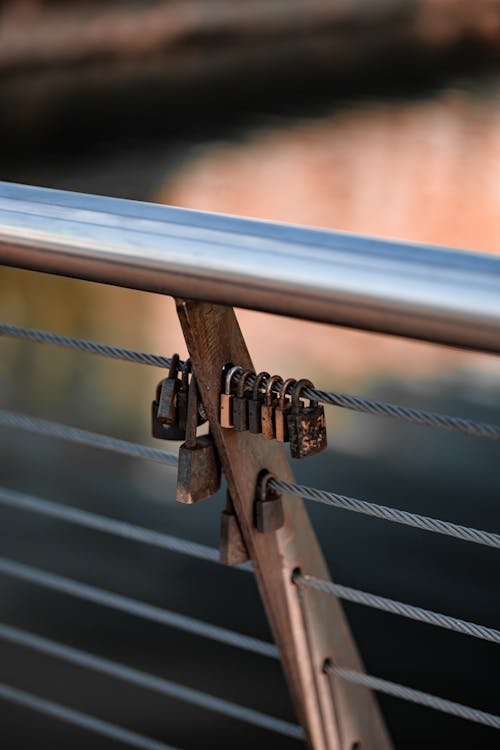A metal railing with a lock on it · Free Stock Photo