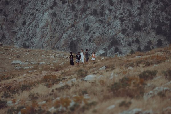 Friends hiking a mountain trail — photo by Omer Tekiner on Pexels