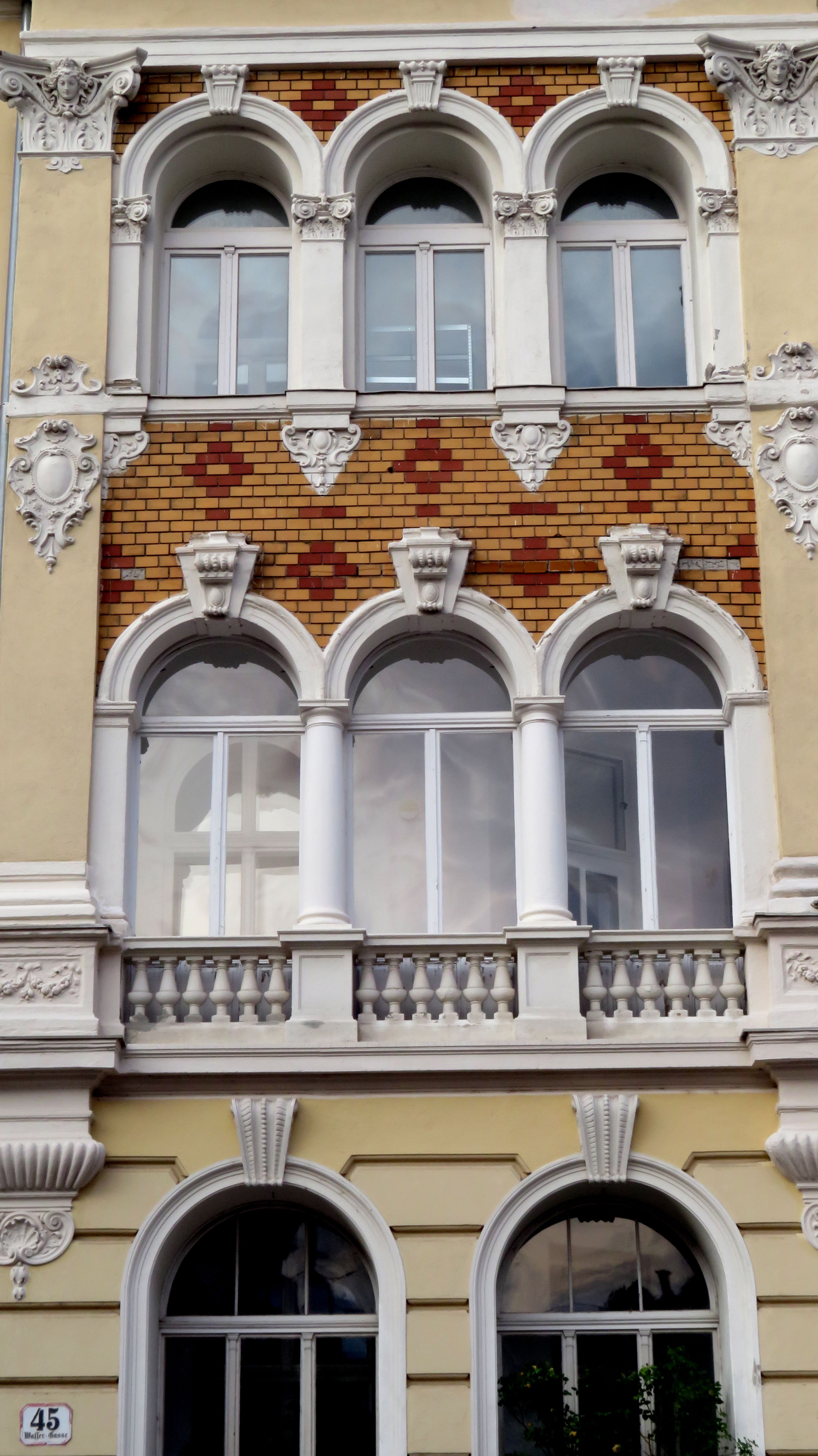A building with ornate windows and arches · Free Stock Photo