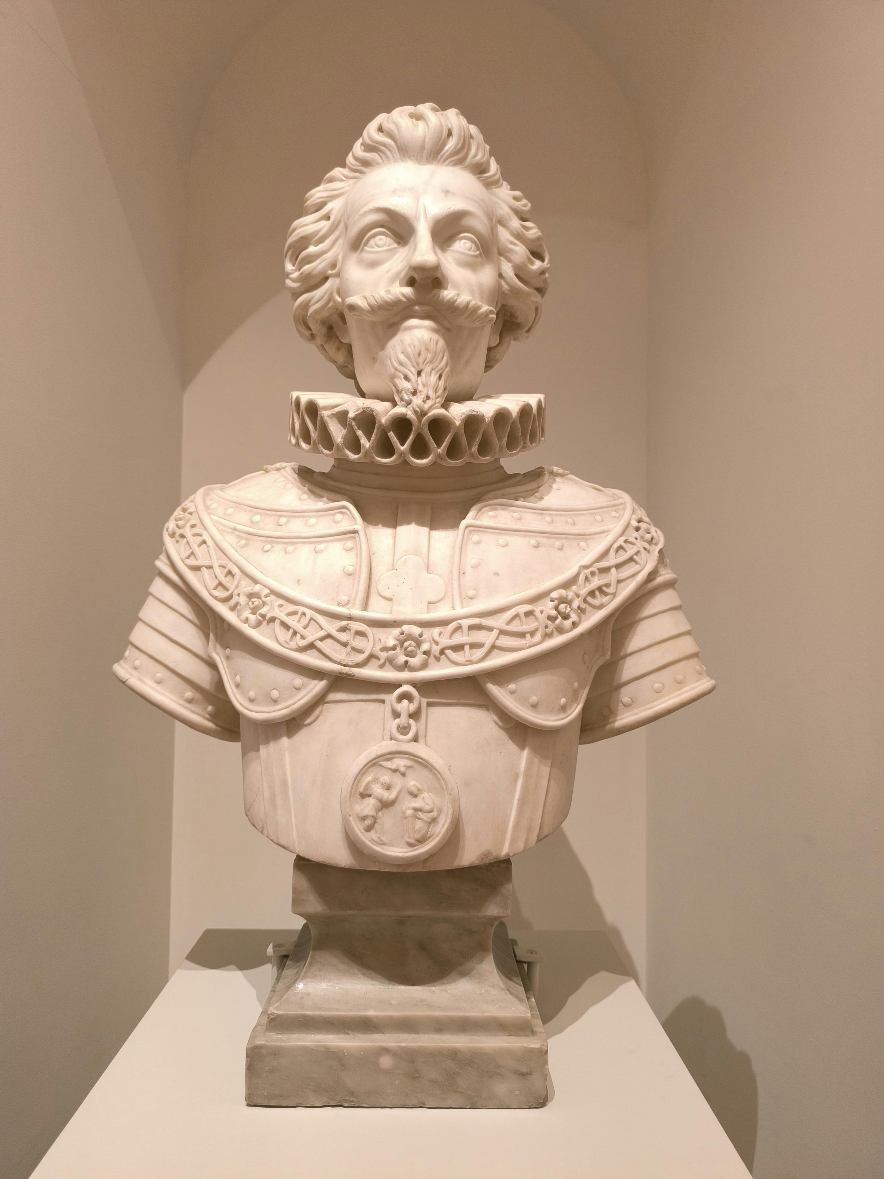 a bust of a man in a white suit