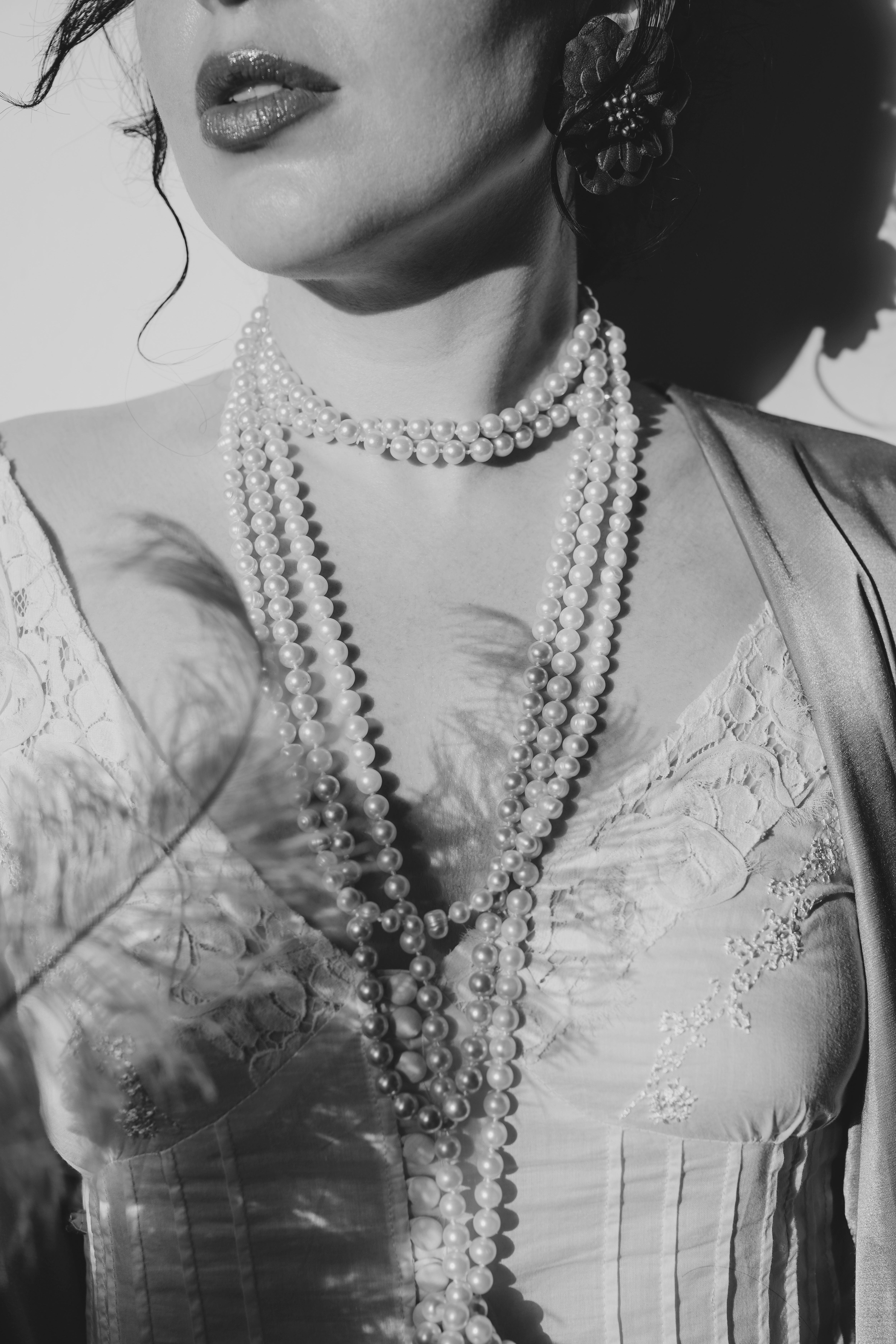 Woman in Black Lace Dress Wearing Pearl Necklace  Free Stock Photo