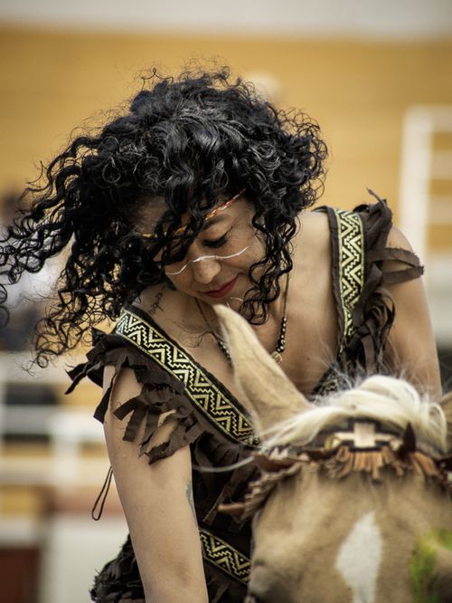Free Woman in tribal attire riding a horse, showcasing elegance and cultural fashion. Stock Photo