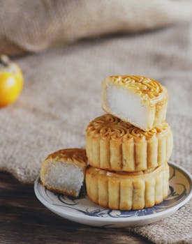 Tasty homemade mooncakes on a plate, perfect for Mid-Autumn Festival celebrations.