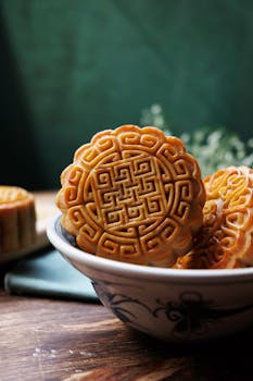 Delicious handcrafted mooncakes displayed in a traditional bowl, perfect for Mid-Autumn celebrations.