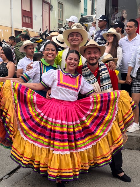 Colorful traditional dance performance during a festival in Aguadas, showcasing vibrant attire.