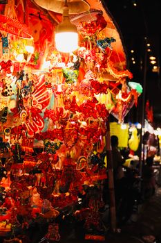 Colorful lanterns at a lively night market, capturing festive and traditional vibes.