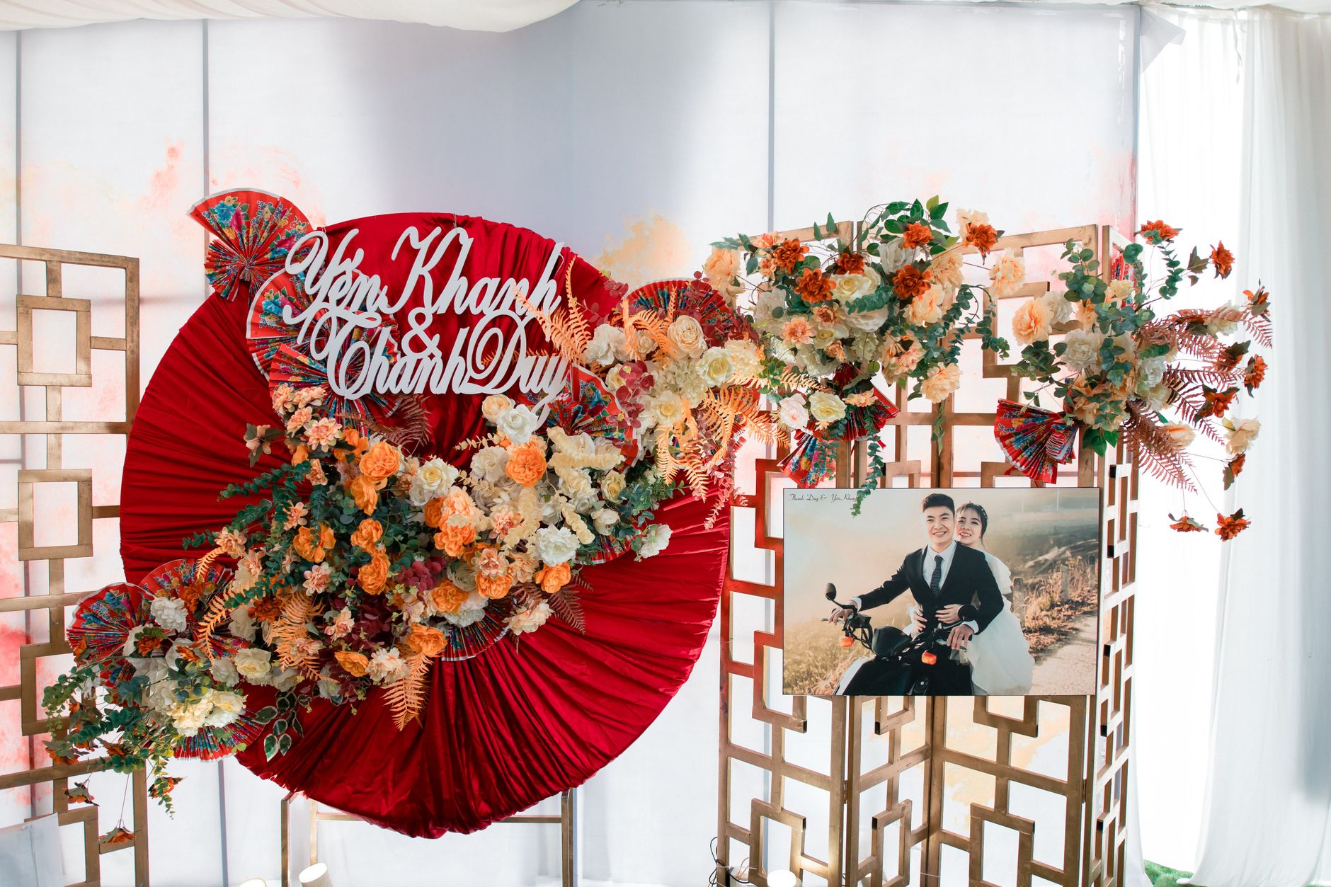Beautiful floral wedding display with elegant decor and personalized sign indoors.