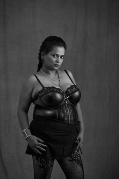 Sophisticated monochrome portrait of a woman in elegant lingerie showcasing fashion style.