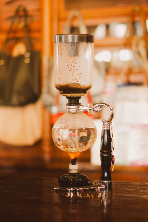 Free A classic coffee syphon in a cozy Mexican café, exuding retro charm. Stock Photo
