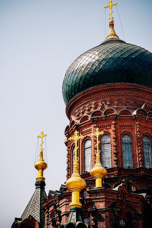 Free Detailed architecture of a historic orthodox church with a prominent dome and golden crosses. Stock Photo