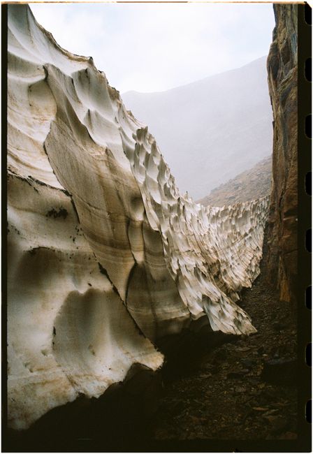 Explore a dramatic canyon landscape with eroded rock formations and misty atmosphere in Spain.