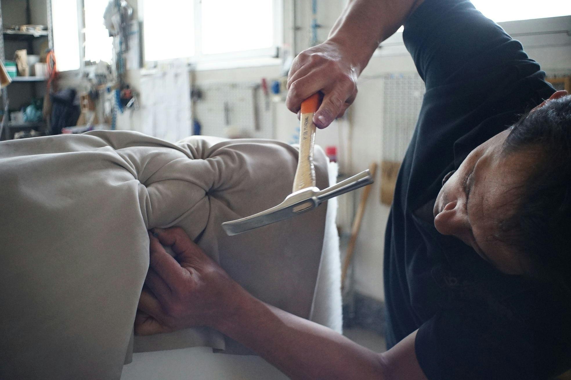 Man Holding Hammer and Nail Repairing Sofa \u00b7 Free Stock Photo