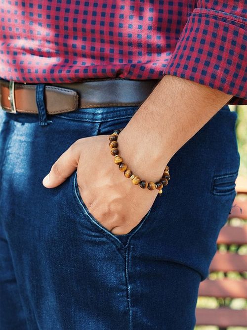 Free Close-up of a man's hand in pocket wearing denim and a stylish bead bracelet. Stock Photo