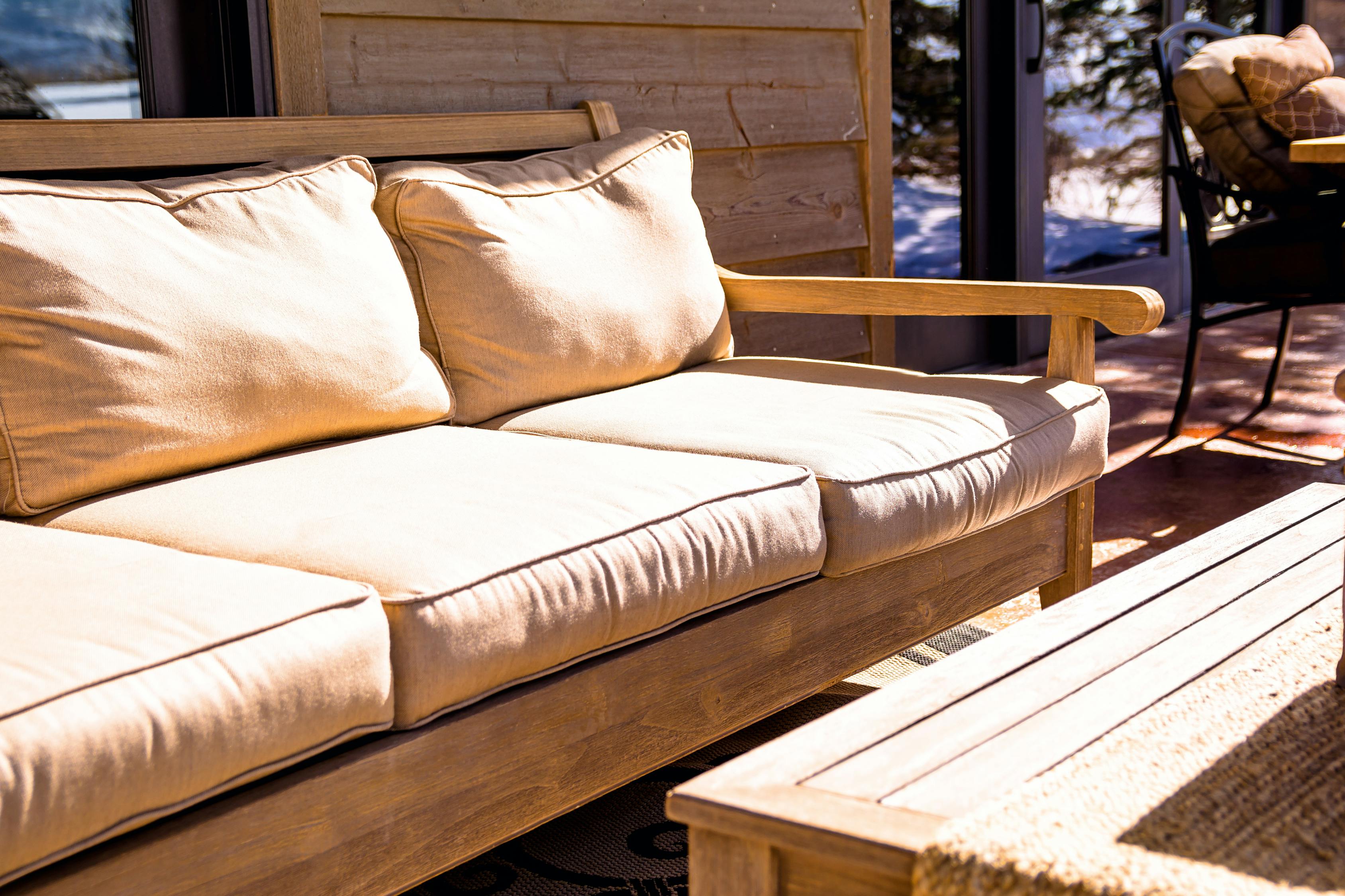 Brown Wooden Futon Placed Near Coffee Table