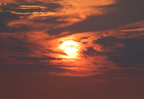 Free Stunning sunset at Cove Island Park in Stamford, CT, with the sun behind clouds casting vibrant colors. Stock Photo