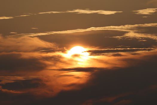 Captivating sunset with dramatic clouds over Stamford, CT, creating a warm and golden ambiance.