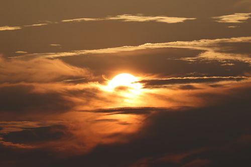 Free Captivating sunset with dramatic clouds over Stamford, CT, creating a warm and golden ambiance. Stock Photo