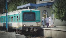 A vintage train with passengers at Carthage station, Tunis, Tunisia.